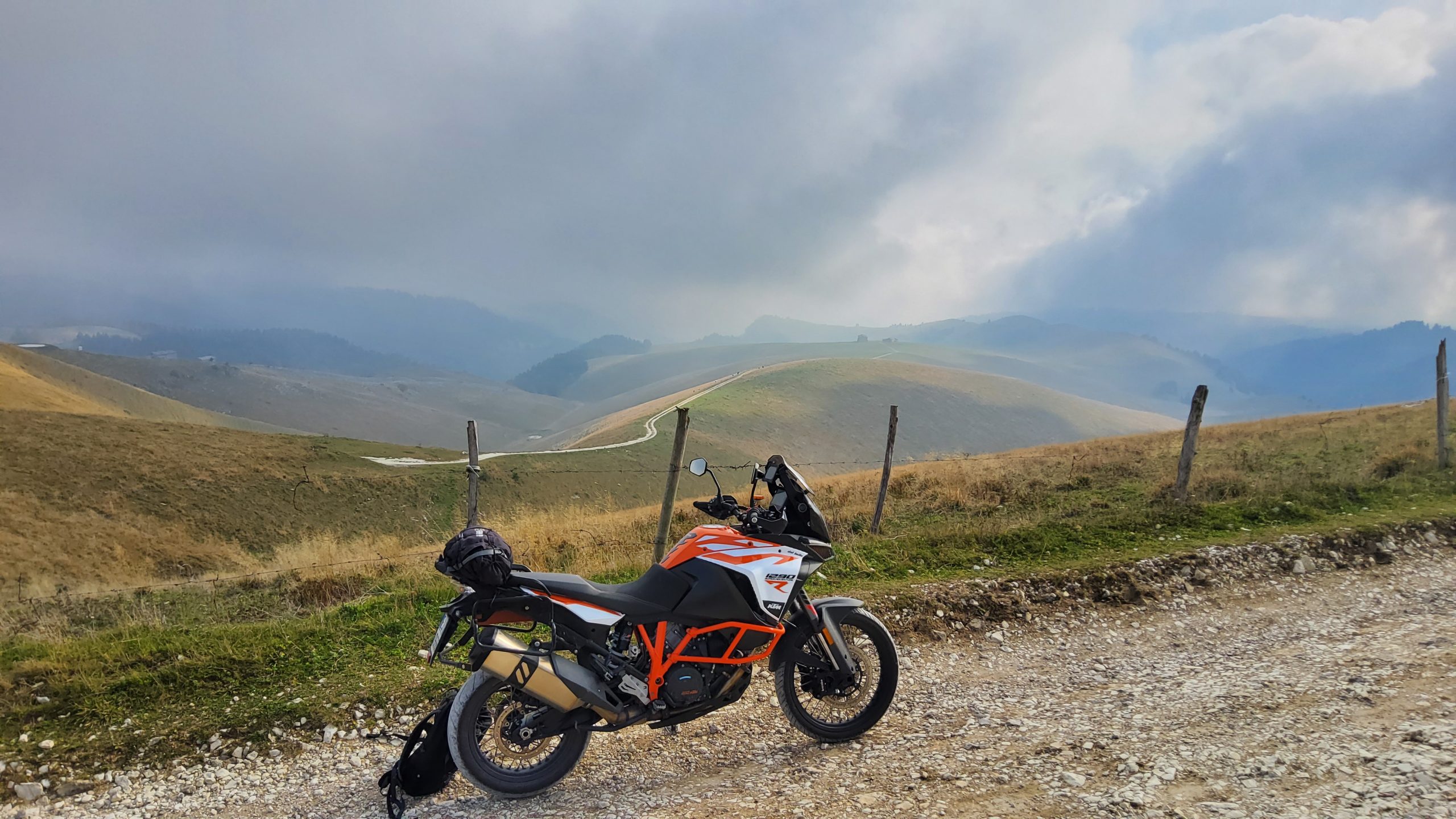 Maxi 'N duro KTM on off-road track in front of the Lessini mountains wild panorama